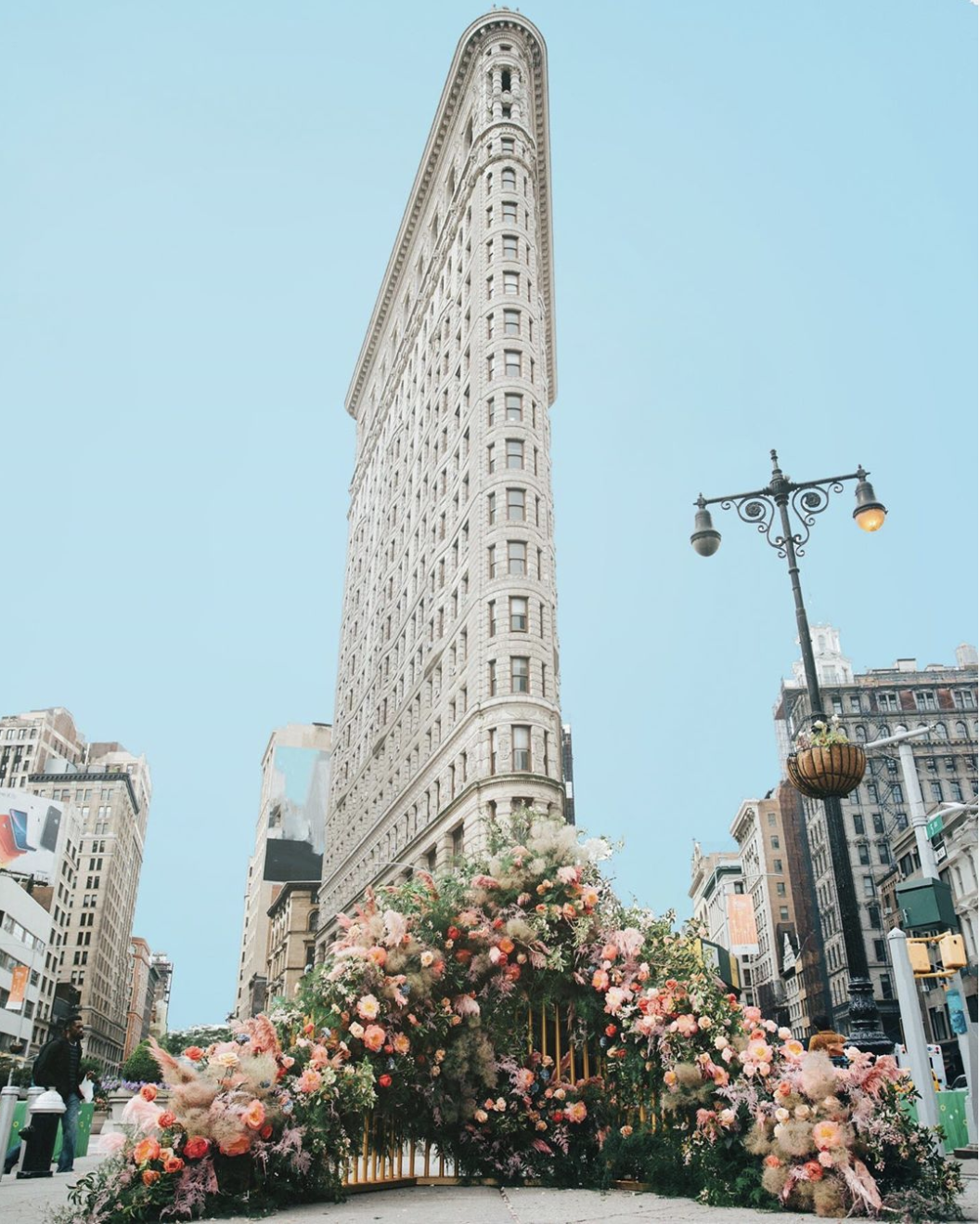 Floral designs in front of the Flat Iron building by East Olivia