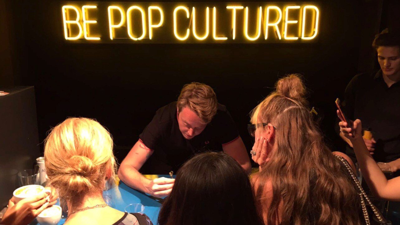 Michael Breach, making custom latte art for guests in the Tresume and E! Entertainment event at NYFW.
