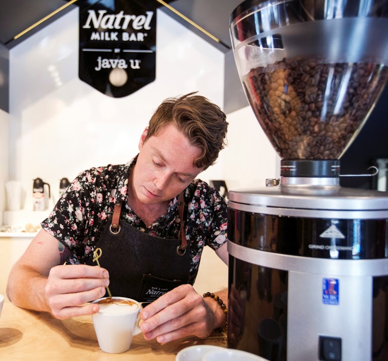 Michael Breach, the coffee artist, mid creation.
